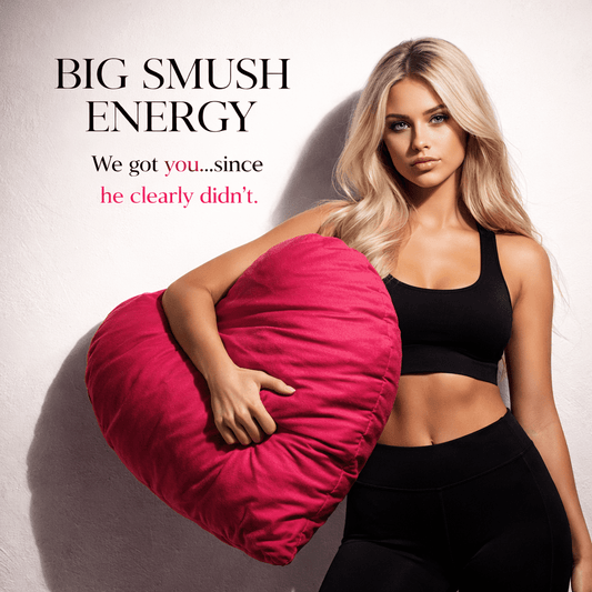 Woman holding Big Smush Energy pink heart-shaped breakup pillow – lifestyle image by The Breakup Pillow