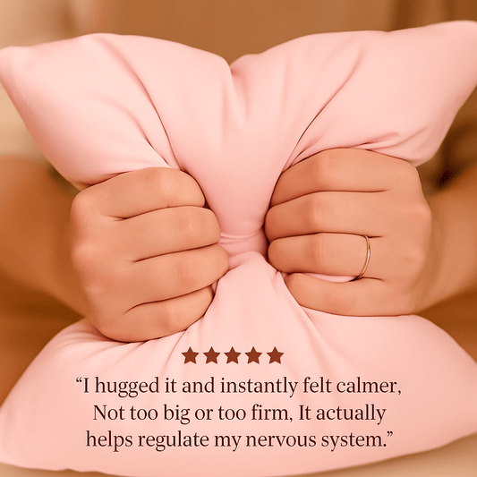 Customer hugging pink breakup pillow — emotional support