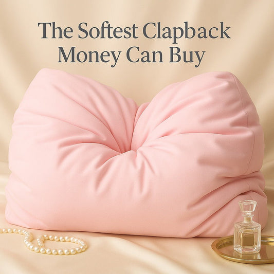 Pink breakup pillow with text: the softest clapback money can buy