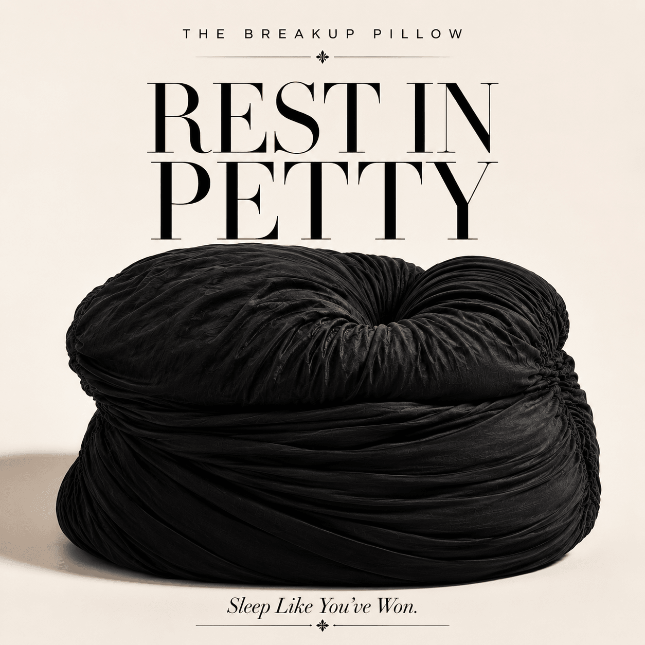 Black pillow with text 'The Breakup Pillow Rest in Petty Sleep Like You've Won' on a beige background