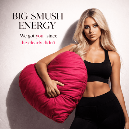 Woman holding Big Smush Energy pink heart-shaped breakup pillow – lifestyle image by The Breakup Pillow