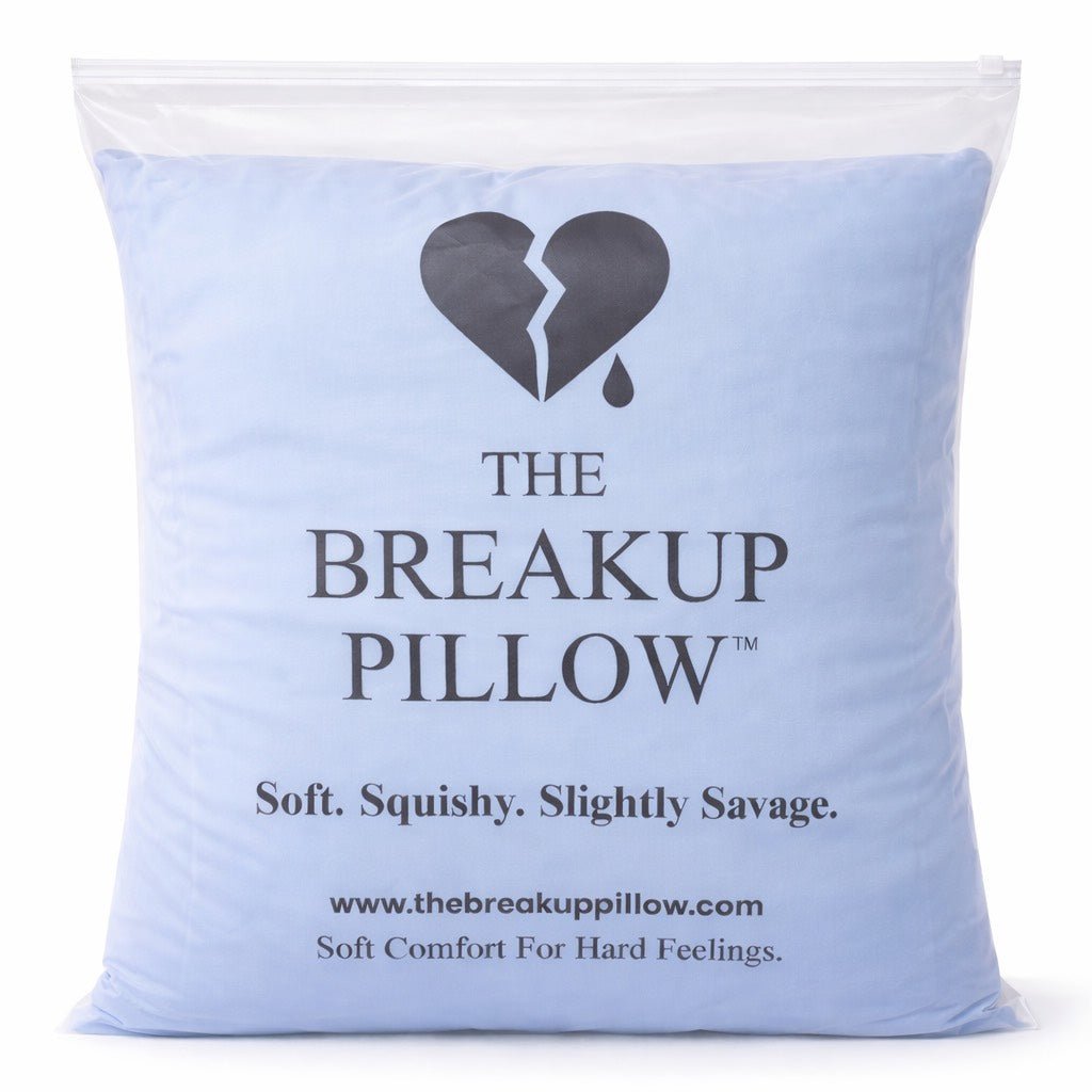 Blue pillow with 'The Breakup Pillow' branding and description on a white background
