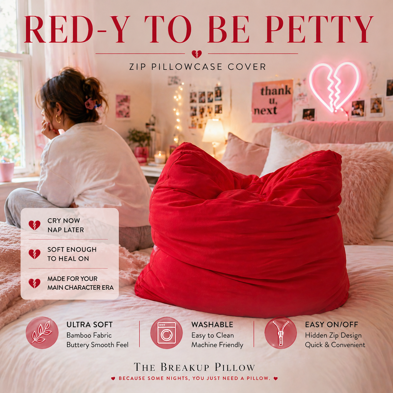 Red pillow with text 'Red-y to be Petty' in a bedroom setting.