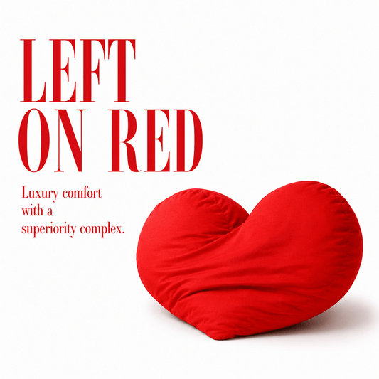 Red heart-shaped pillow with text 'LEFT ON RED' on a white background