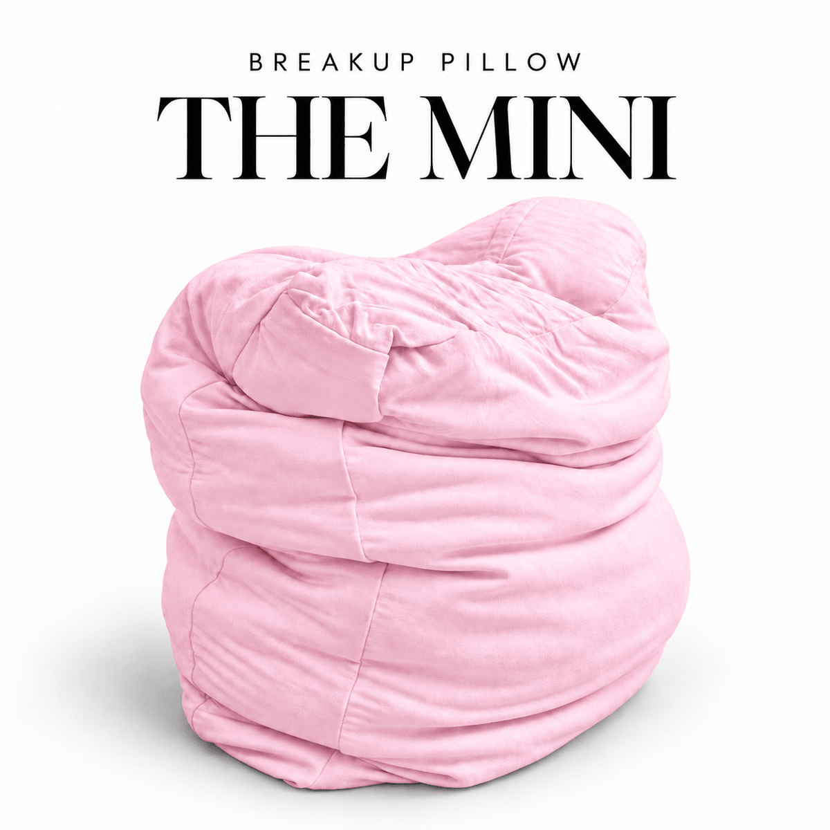The Mini Breakup Pillow in baby pink – Post-Cry Pretty 16x16x3 small squishy cuddle pillow, folded and slouched