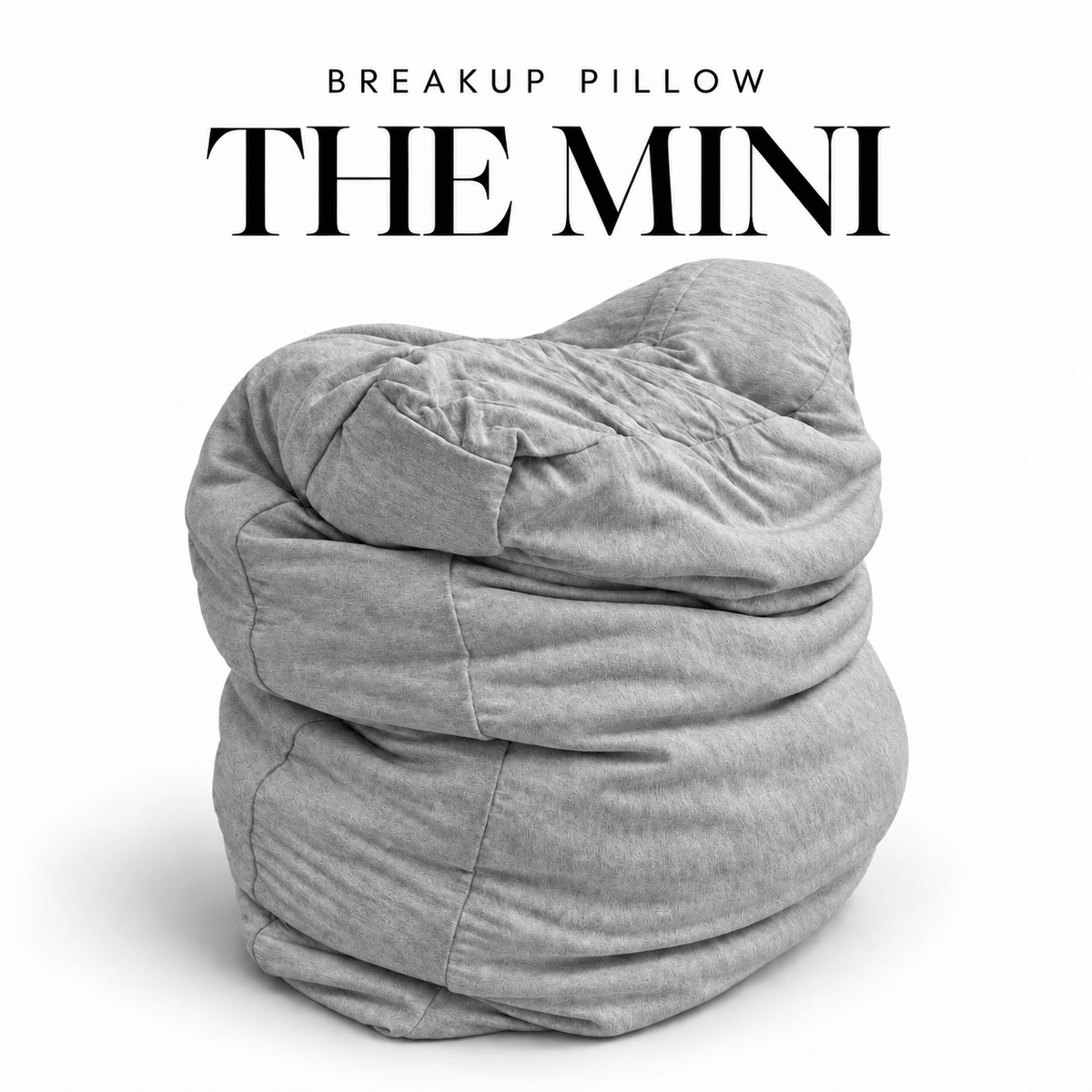 The Mini Breakup Pillow in heather gray – 16x16x3 small squishy cuddle pillow, folded and slouched