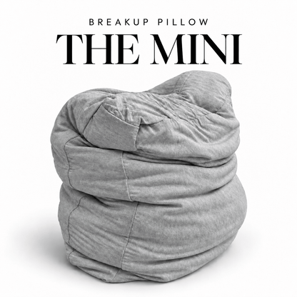 The Mini Breakup Pillow in heather gray – 16x16x3 small squishy cuddle pillow, folded and slouched