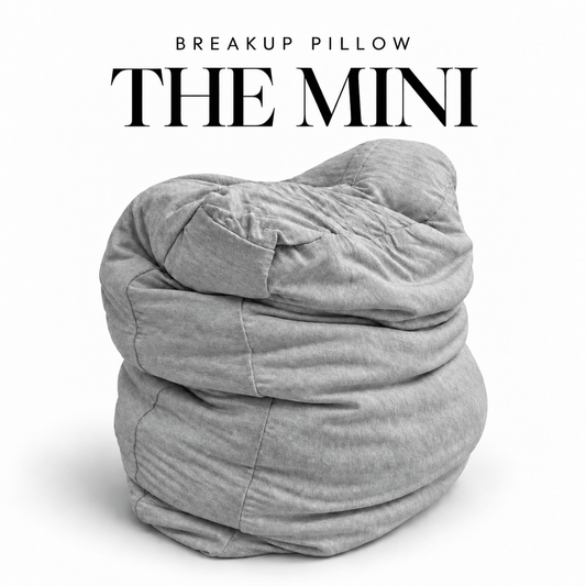 The Mini Breakup Pillow in heather gray – 16x16x3 small squishy cuddle pillow, folded and slouched