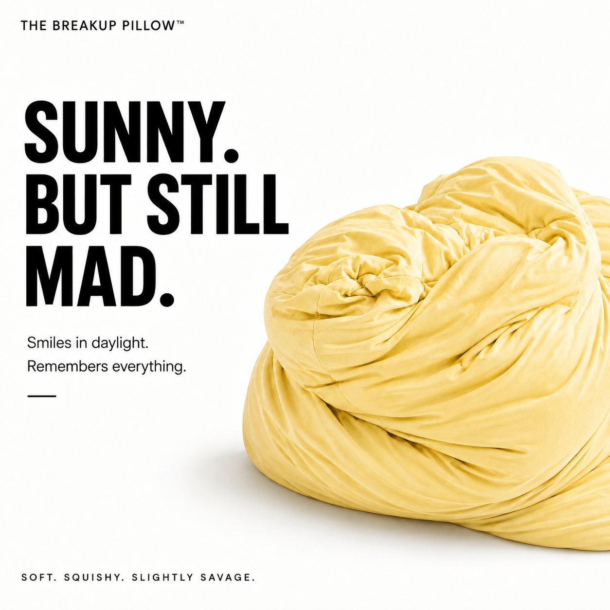 A yellow wrinkled throw pillow on a white background with bold black text reading 'SUNNY. BUT STILL MAD.