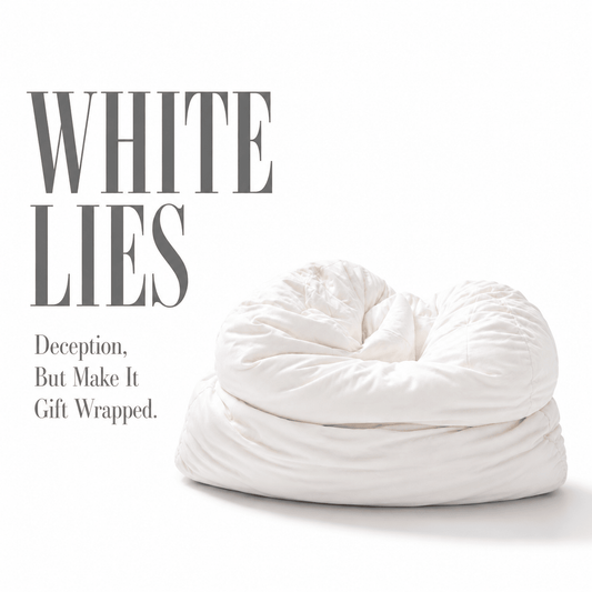 White soft pillow with text 'White Lies' on a white background